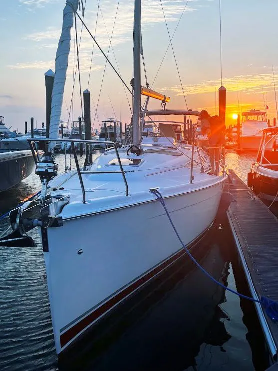 Slide: The Image of Sailboat docked at sunset, 2005 Hunter 38 model, marina setting. - 2