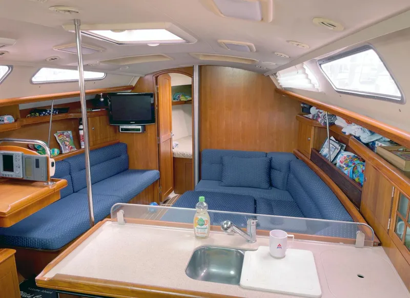 Slide: The Image of Interior of 2005 Hunter 38 sailboat with cozy seating and modern amenities. - 3