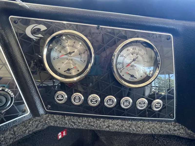 Slide: The Image of Dashboard of 2025 Crestliner 2050 Fish Hawk with RPM and speed gauges. - 12