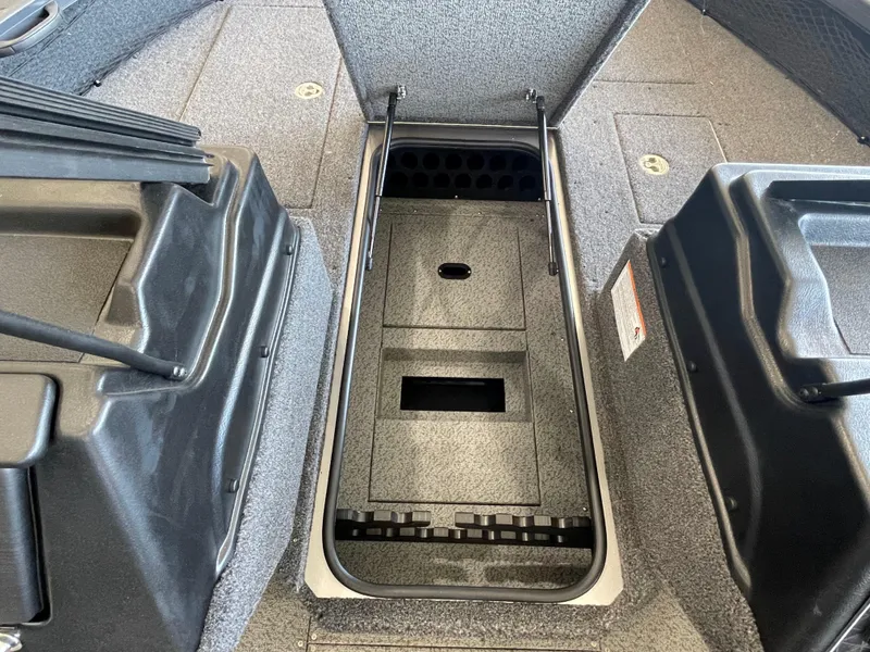 Slide: The Image of 2025 Crestliner 2050 Fish Hawk interior storage compartment, open and spacious. - 14