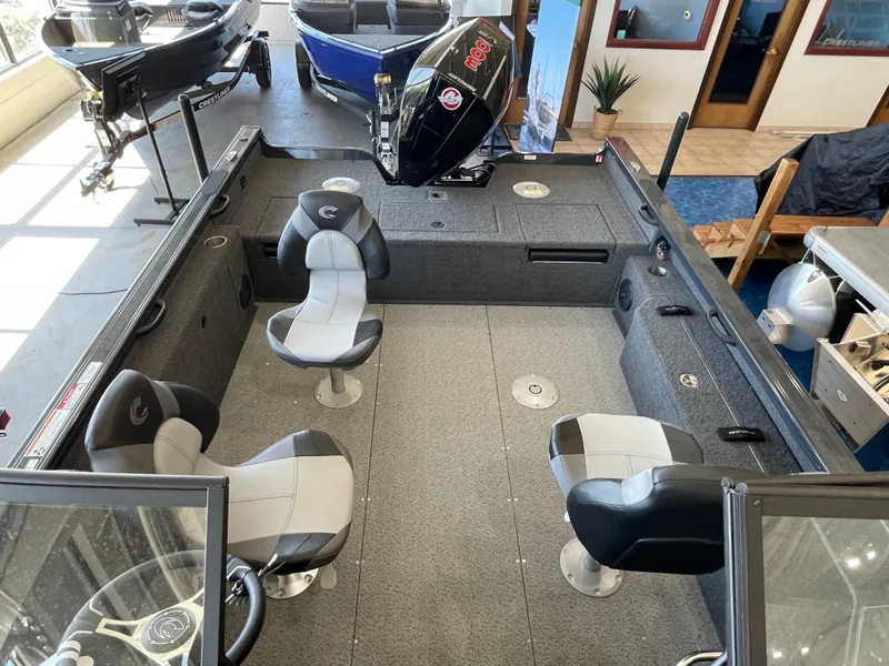 Slide: The Image of 2025 Crestliner 2050 Fish Hawk boat interior with four seats and modern design. - 19