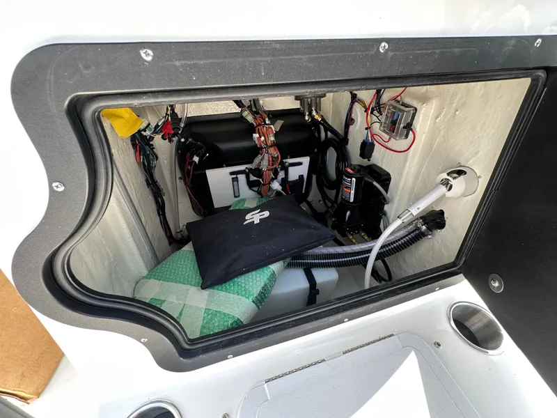 Slide: The Image of 2026 Sea Pro 230 Bay boat compartment with wiring and equipment. - 12