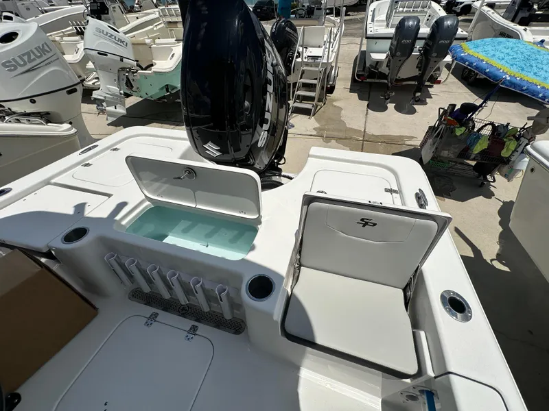 Slide: The Image of 2026 Sea Pro 230 Bay boat with Suzuki outboard engines, featuring seating and storage compartments. - 14