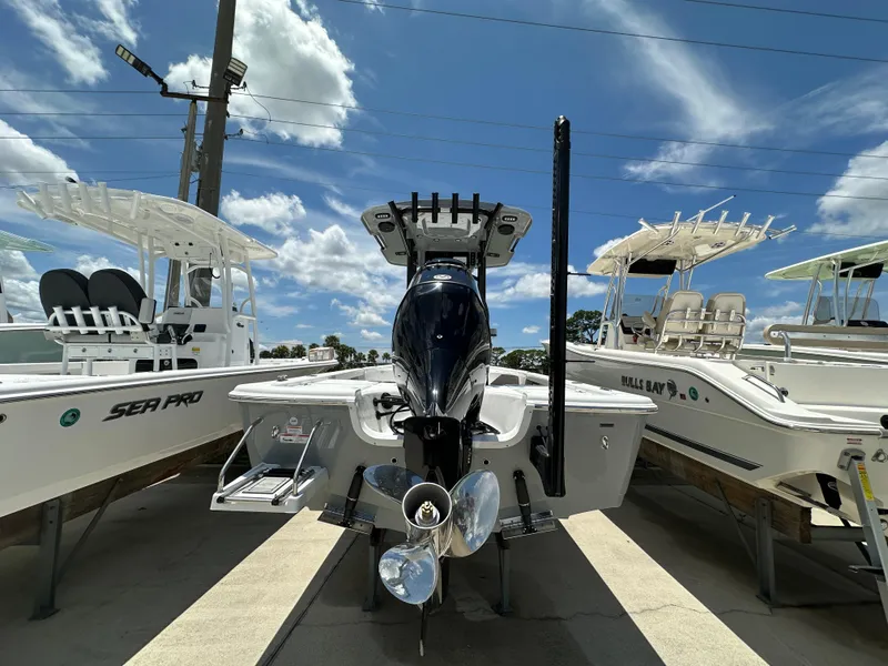 Slide: The Image of 2026 Sea Pro 230 Bay boat with powerful outboard motor, displayed under a clear blue sky. - 3