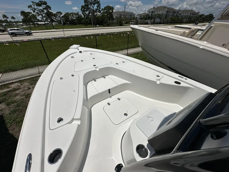 Slide: The Image of 2026 Sea Pro 230 Bay boat deck, spacious layout, white finish, outdoor display. - 5