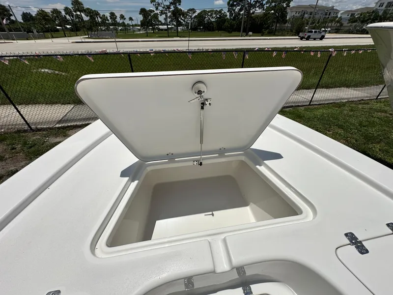 Slide: The Image of Open storage compartment on 2026 Sea Pro 230 Bay boat, showcasing spacious interior. - 7