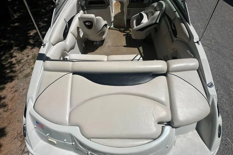 Slide: The Image of 2007 Crownline 220 LS boat interior with beige seating and steering wheel. - 12