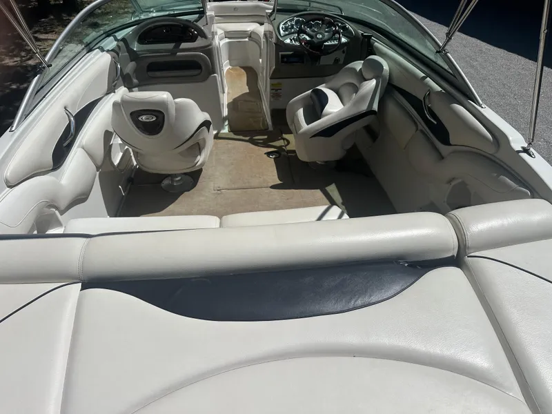 Slide: The Image of 2007 Crownline 220 LS boat interior with white seating and steering wheel. - 15