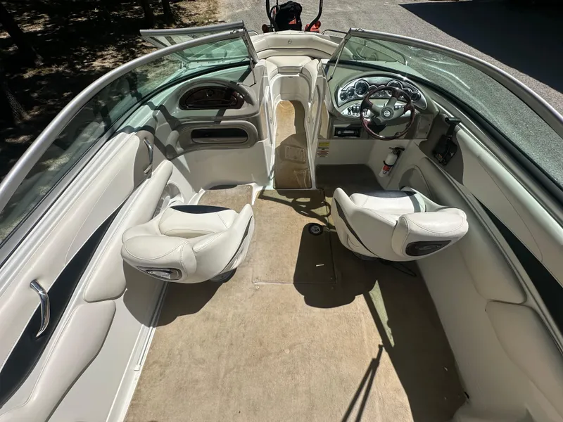 Slide: The Image of 2007 Crownline 220 LS boat interior with white seating and dashboard. - 18
