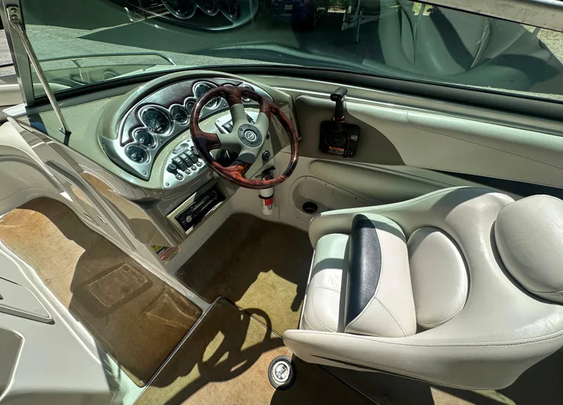 Slide: The Image of 2007 Crownline 220 LS boat interior with steering wheel and dashboard controls. - 20