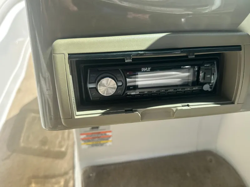 Slide: The Image of 2007 Crownline 220 LS boat stereo system, featuring a Pyle audio unit. - 21