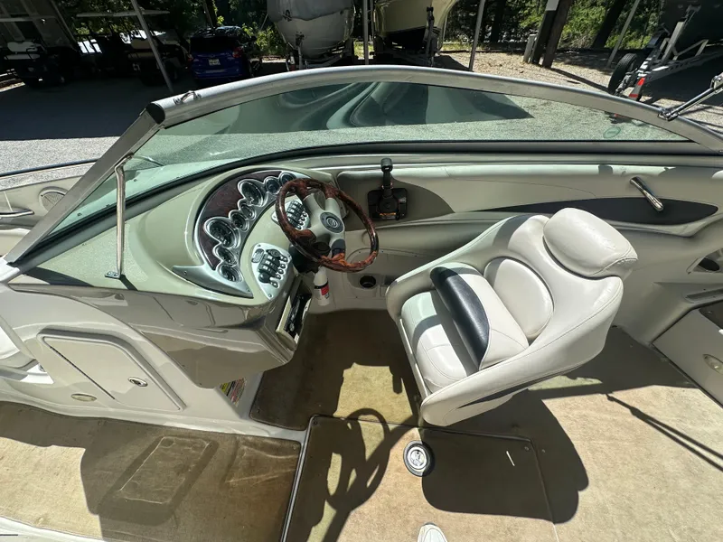 Slide: The Image of 2007 Crownline 220 LS boat interior with steering wheel and captain's seat. - 22