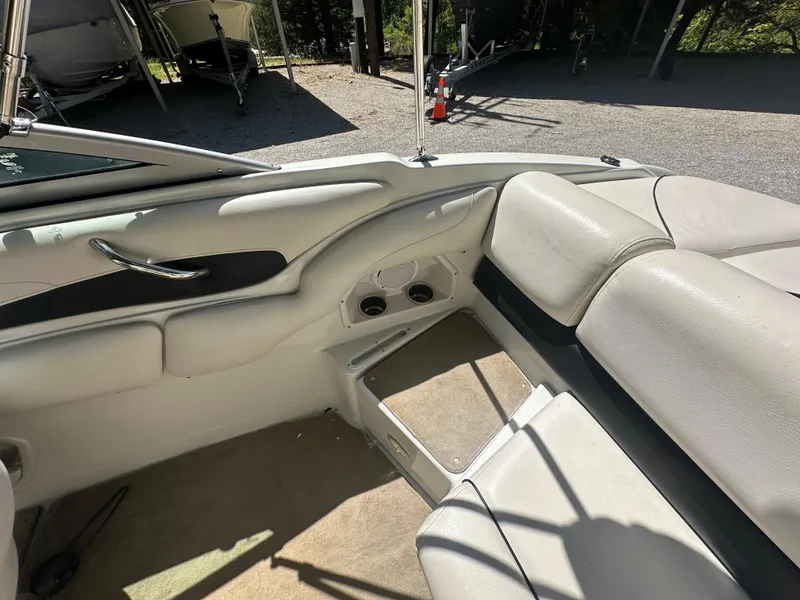 Slide: The Image of Interior of a 2007 Crownline 220 LS boat with beige seating and carpet. - 26