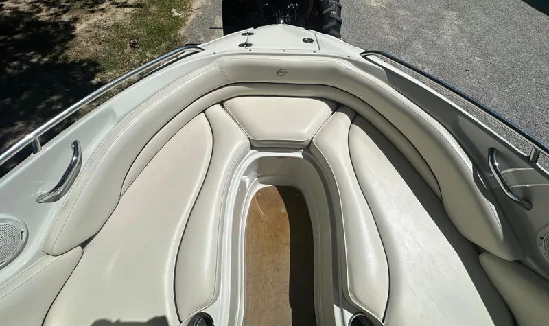 Slide: The Image of 2007 Crownline 220 LS boat interior with white leather seating and stainless steel railings. - 30