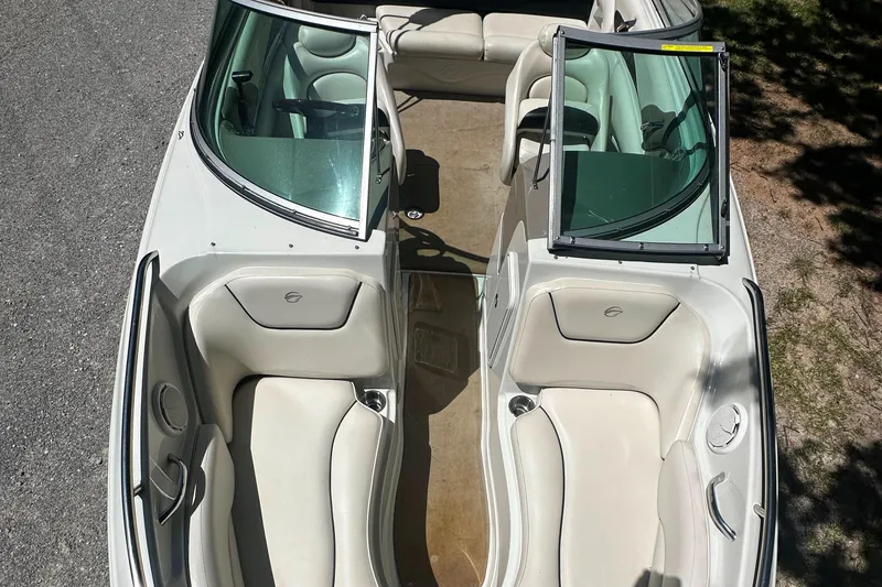 Slide: The Image of 2007 Crownline 220 LS boat interior with white seating and open windshield. - 31