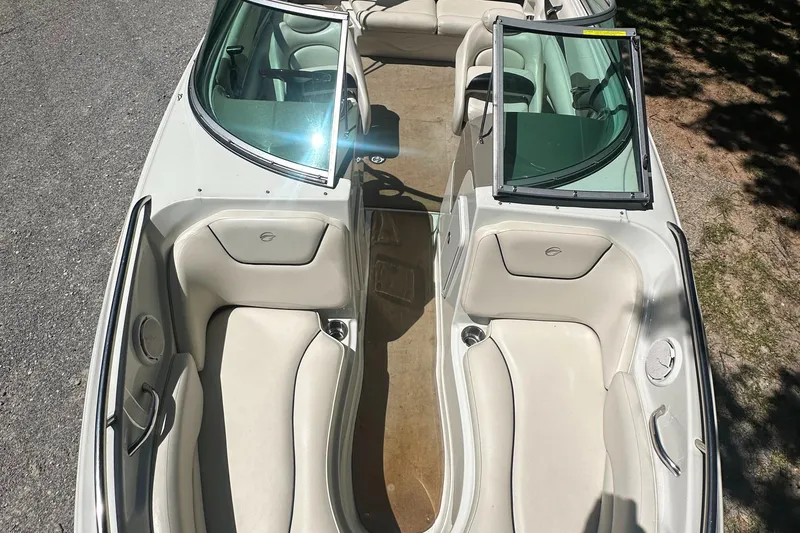 Slide: The Image of 2007 Crownline 220 LS boat interior with beige seating and open windshield. - 33
