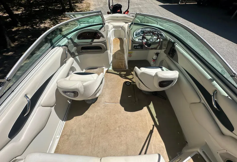 Slide: The Image of 2007 Crownline 220 LS boat interior with beige seating and steering wheel. - 9