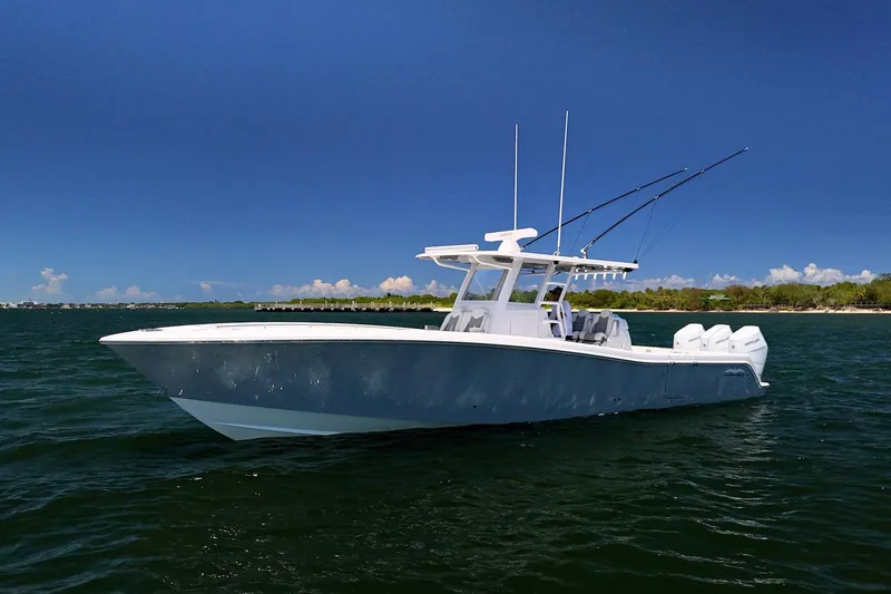 The Image of 2025 Invincible 39 Open Fisherman boat on calm water under clear blue sky. - 0