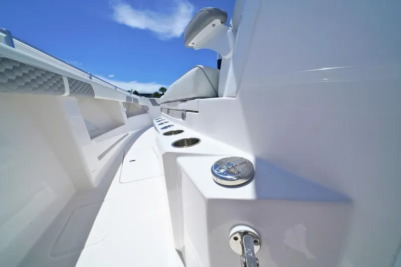 Slide: The Image of 2025 Invincible 39 Open Fisherman boat interior with sleek design and cup holders. - 13