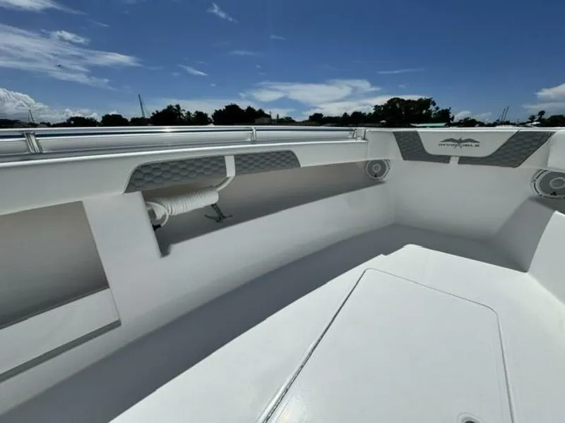 Slide: The Image of 2025 Invincible 39 Open Fisherman boat interior under clear blue sky. - 14