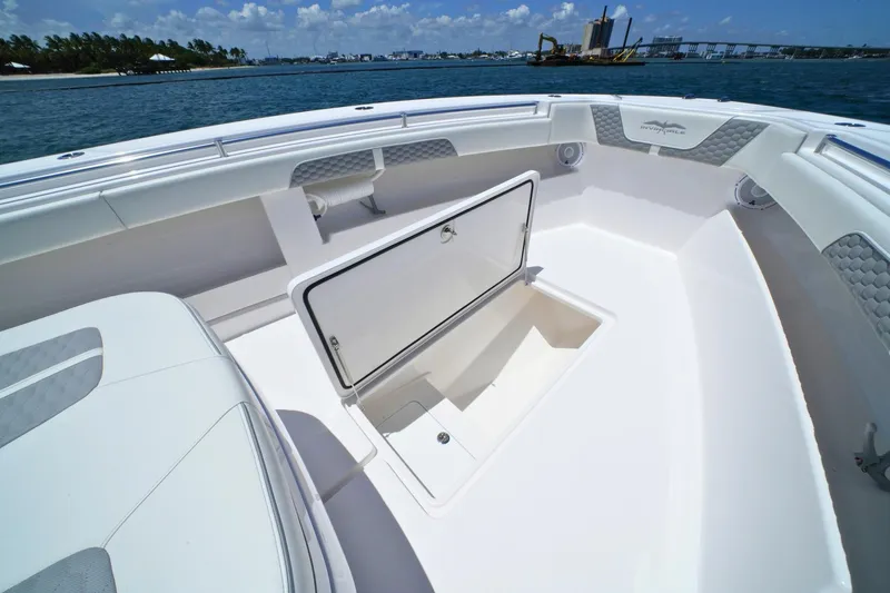 Slide: The Image of 2025 Invincible 39 Open Fisherman boat with open storage compartment on deck. - 15