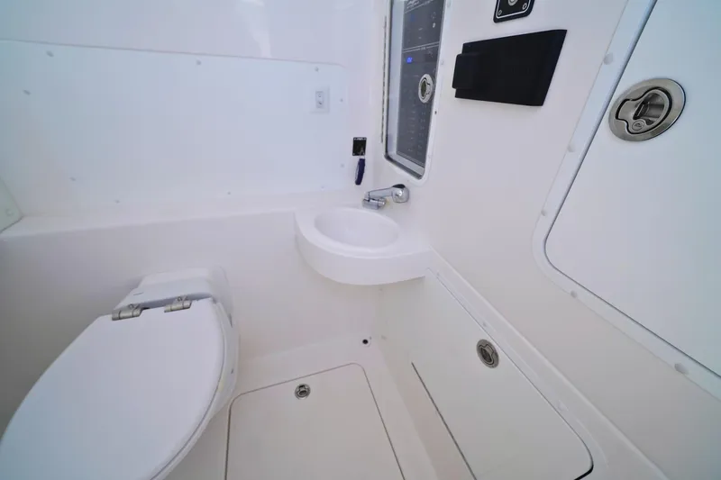 Slide: The Image of 2025 Invincible 39 Open Fisherman boat bathroom with modern fixtures and compact design. - 20