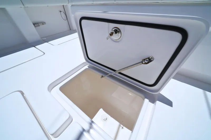 Slide: The Image of Open storage compartment on 2025 Invincible 39 Open Fisherman boat. - 27