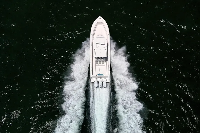 Slide: The Image of Aerial view of 2025 Invincible 39 Open Fisherman boat cruising on water. - 3