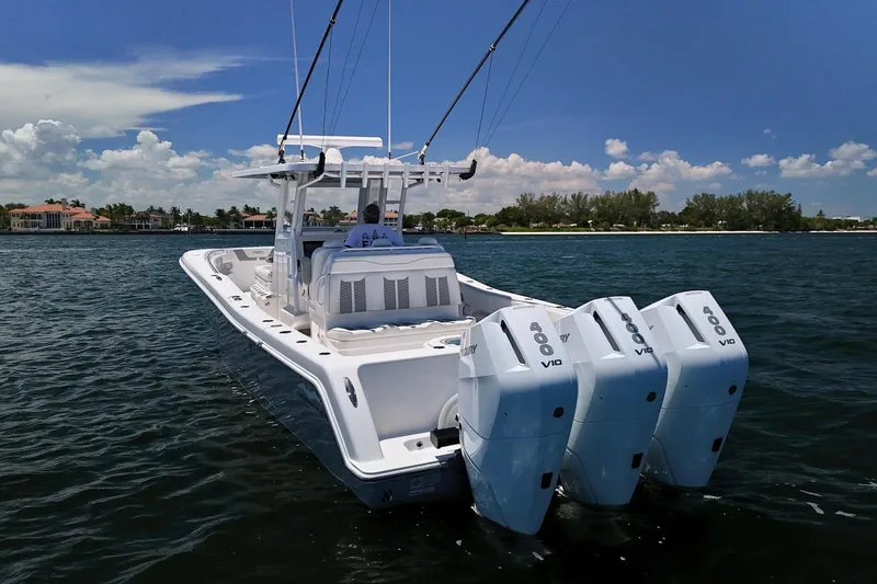 Slide: The Image of 2025 Invincible 39 Open Fisherman boat with triple Mercury V10 engines on the water. - 4