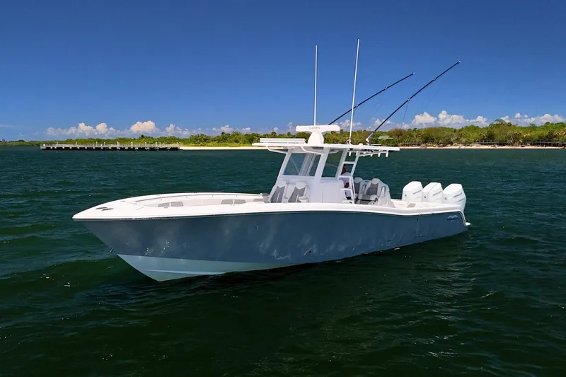 Slide: The Image of 2025 Invincible 39 Open Fisherman boat on open water, clear sky background. - 5