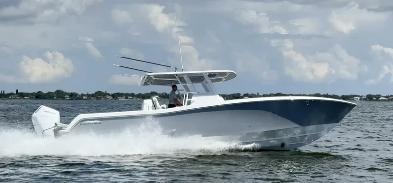 Slide: The Image of 2025 Invincible 39 Open Fisherman boat cruising on water under cloudy sky. - 6