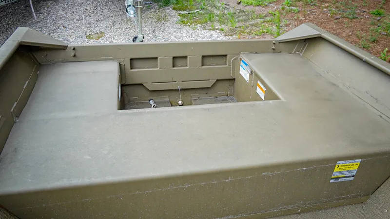 Slide: The Image of 2025 G3 1548 VBW boat interior with storage compartments and rugged design. - 4