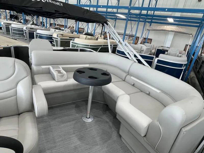 Slide: The Image of 2026 Godfrey Xperience 2086 FX pontoon boat interior with plush seating and cup holders. - 12