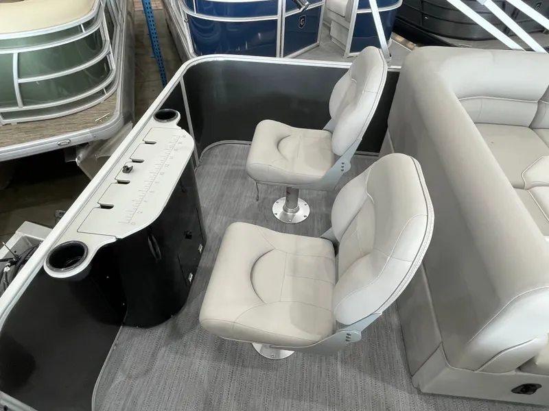 Slide: The Image of Interior of 2026 Godfrey Xperience 2086 FX boat with swivel seats and control panel. - 14