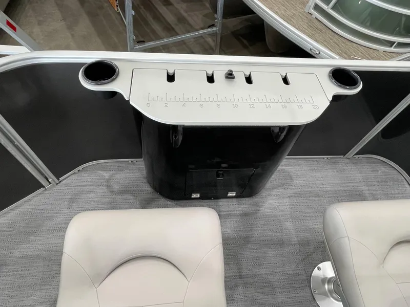 Slide: The Image of 2026 Godfrey Xperience 2086 FX boat interior with cup holders and measuring board. - 15