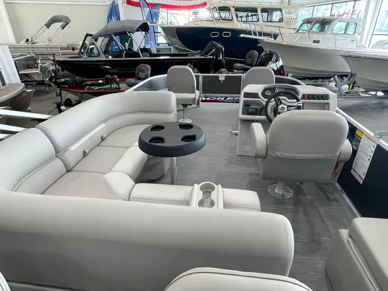 Slide: The Image of Interior of 2026 Godfrey Xperience 2086 FX pontoon boat with plush seating and modern helm. - 18