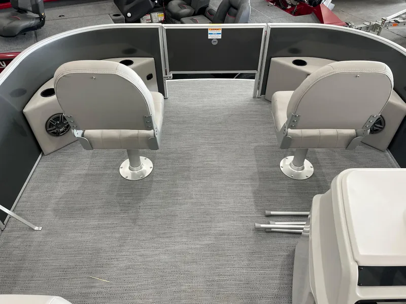 Slide: The Image of 2026 Godfrey Xperience 2086 FX boat interior with two swivel seats and carpeted flooring. - 7