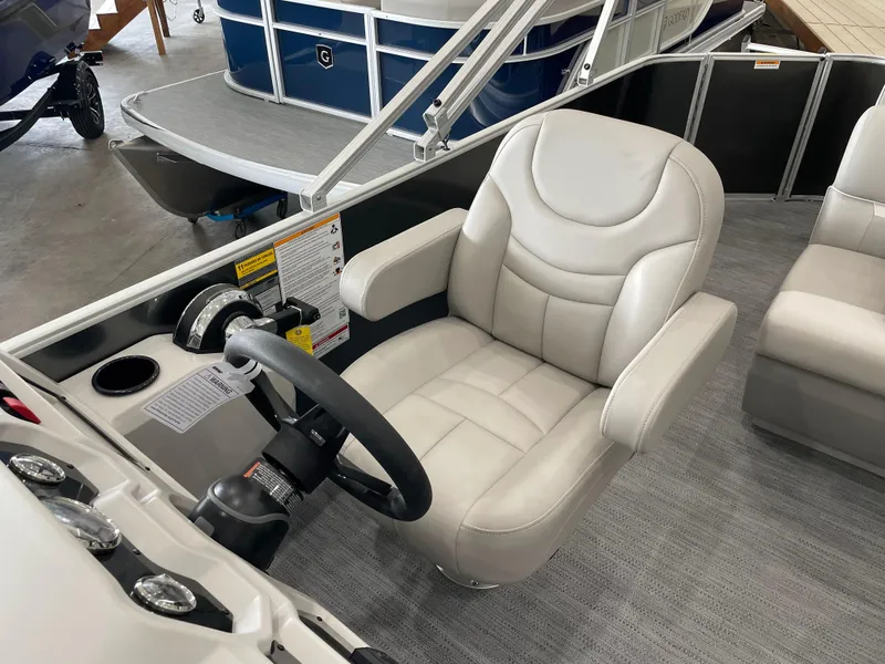 Slide: The Image of Captain's seat of 2026 Godfrey Xperience 2086 FX pontoon boat, featuring modern controls. - 8