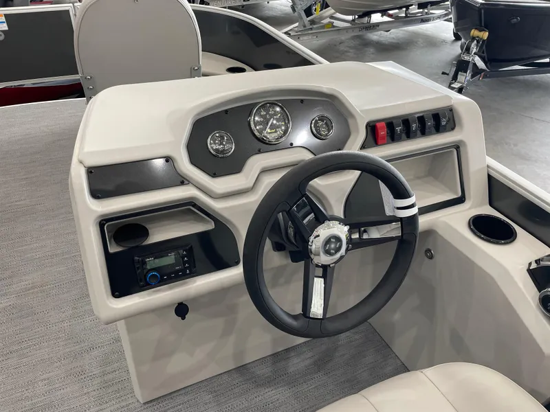 Slide: The Image of 2026 Godfrey Xperience 2086 FX boat dashboard with steering wheel and control panel. - 9