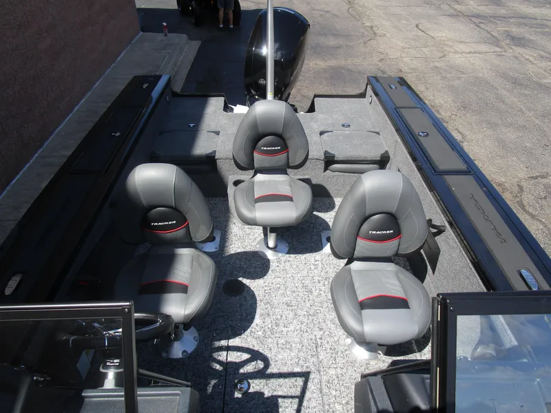 Slide: The Image of 2026 Tracker Targa V18 Combo boat interior with four gray seats and spacious layout. - 12