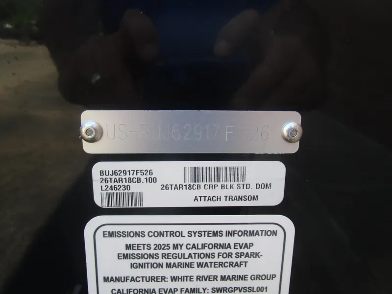 Slide: The Image of 2026 Tracker Targa V18 Combo boat identification and emissions compliance labels. - 13