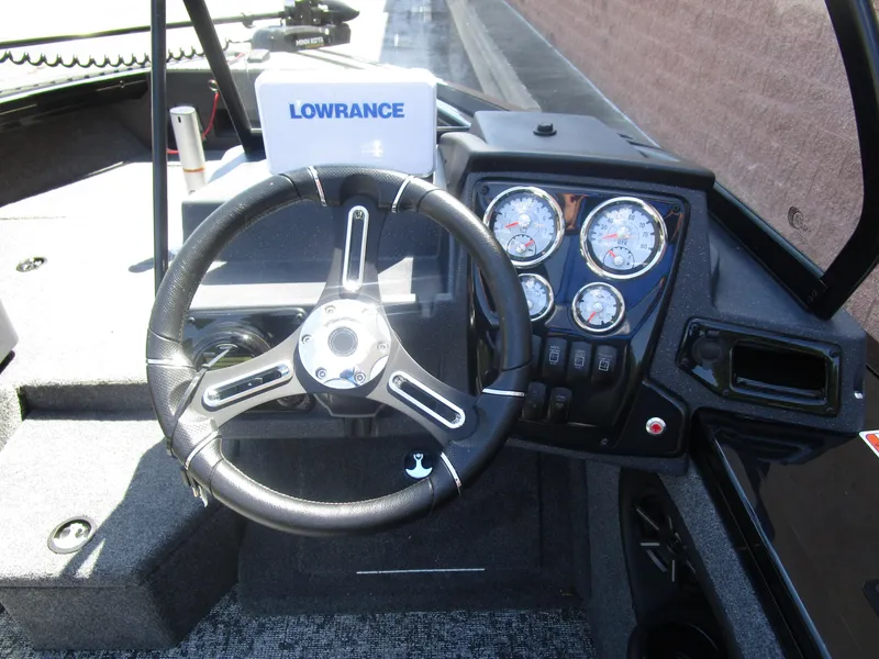 Slide: The Image of Steering wheel and dashboard of 2026 Tracker Targa V18 Combo boat with Lowrance display. - 5