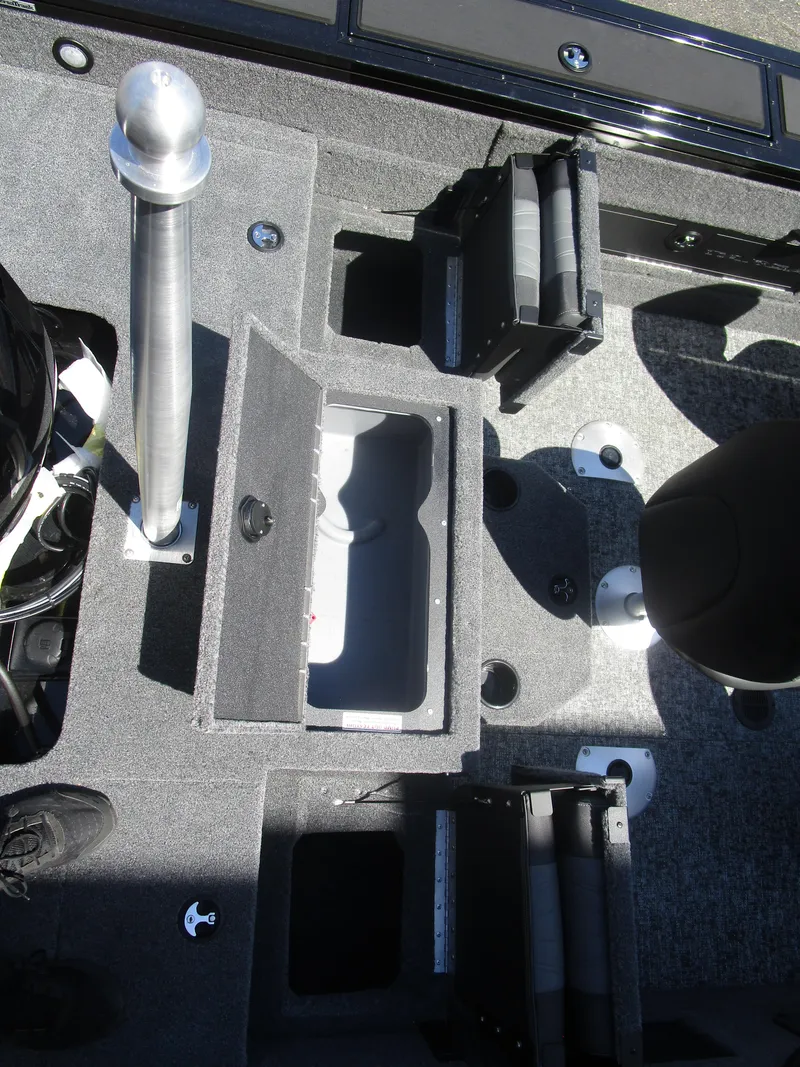 Slide: The Image of 2026 Tracker Targa V18 Combo boat interior with storage compartments and seating. - 6