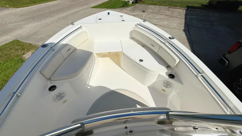 Slide: The Image of 2012 Cobia 217 Center Console boat with spacious seating and sleek design. - 10