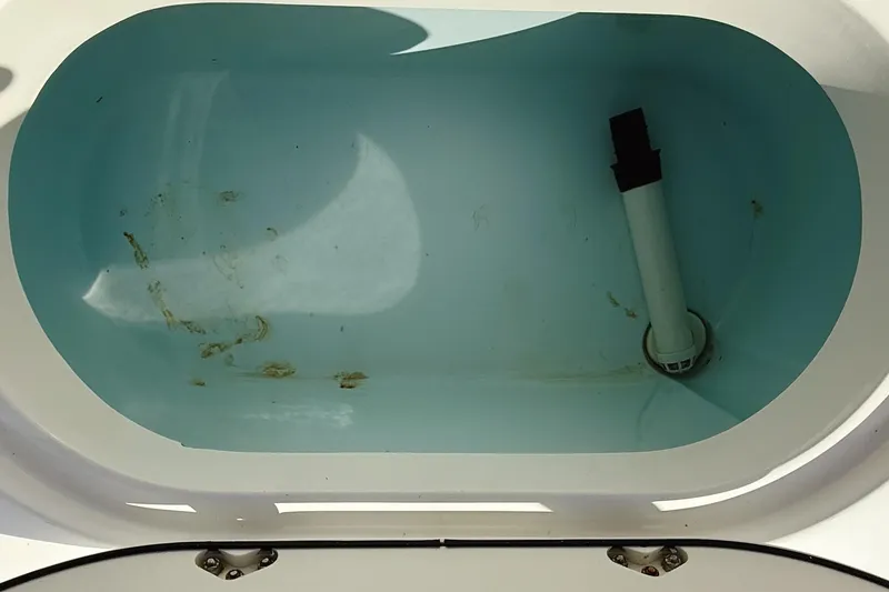 Slide: The Image of Livewell tank in a 2012 Cobia 217 Center Console boat, showing interior details. - 17