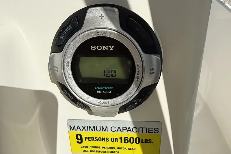 Slide: The Image of Sony marine audio system on 2012 Cobia 217 Center Console boat, capacity label visible. - 8
