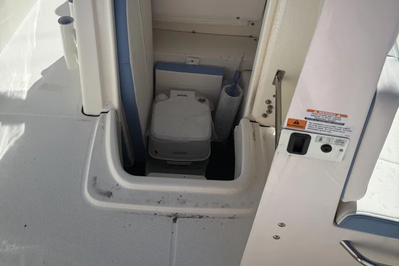 Slide: The Image of 2025 Robalo R200 Center Console boat with onboard portable toilet. - 10