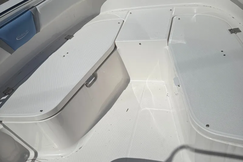 Slide: The Image of 2025 Robalo R200 Center Console boat interior with storage compartments. - 13
