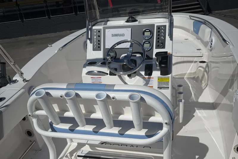 Slide: The Image of 2025 Robalo R200 Center Console boat interior with steering wheel and control panel. - 5