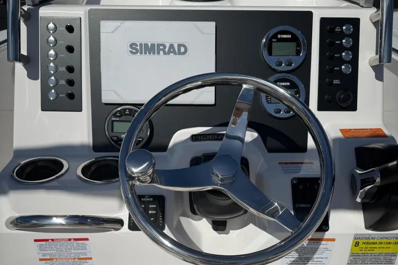 Slide: The Image of 2025 Robalo R200 Center Console dashboard with Simrad display and Yamaha gauges. - 6
